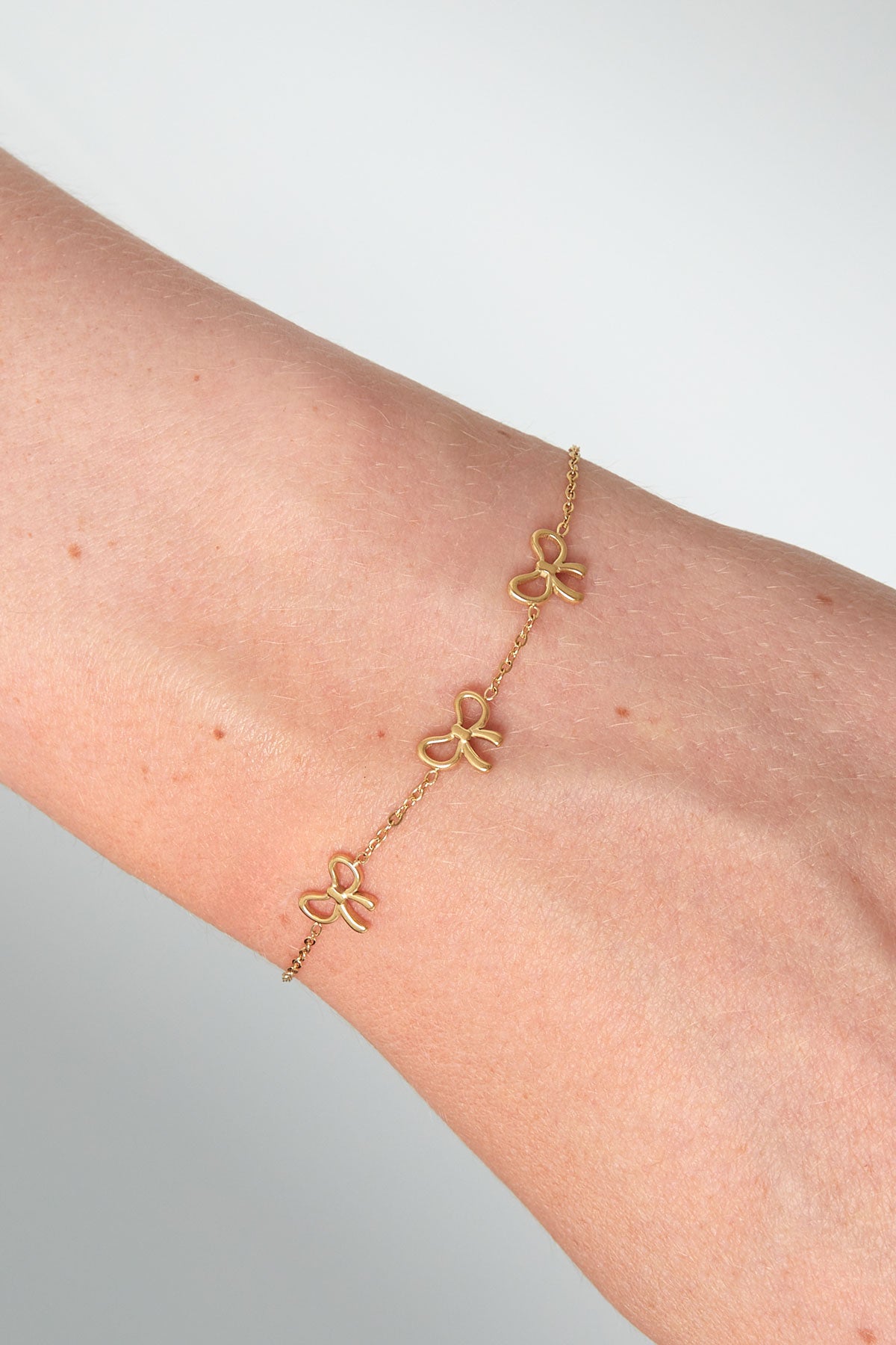 Armband strikjes goud