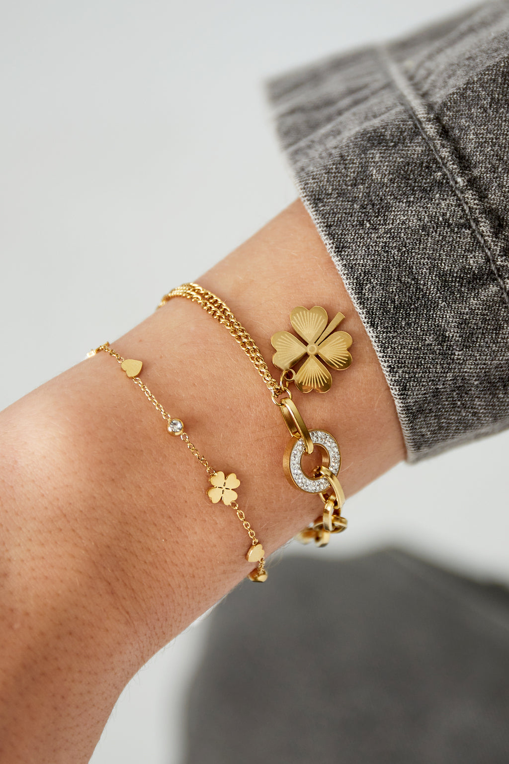 Armband bloem, ster en hartjes goud